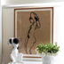 Ink nude on brown paper makes for a strong feature piece in a passionate art collectors home in St Kilda, Melbourne